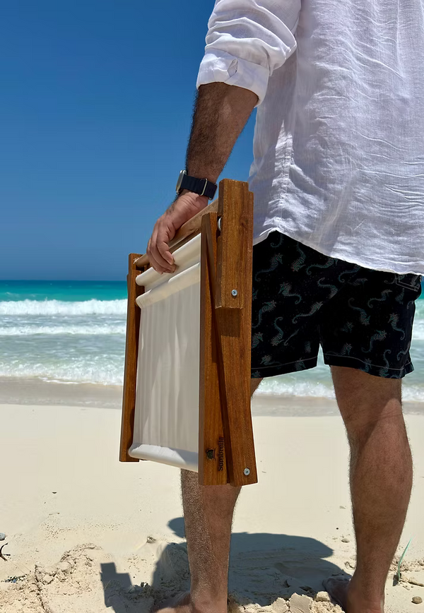 Carrying the folded Sumbrella on the beach